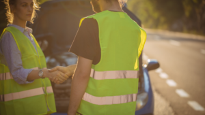 two people handshake on the street